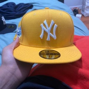 a yellow hat brand new w stickers never worn lmk a price !